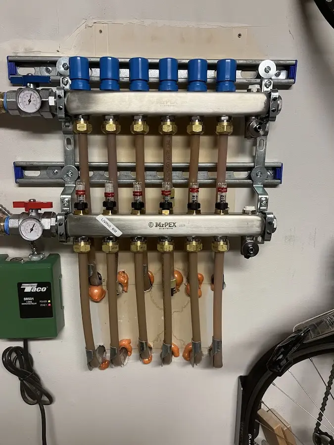 Plumber performing Water Heater Repair at a residential property in Commerce